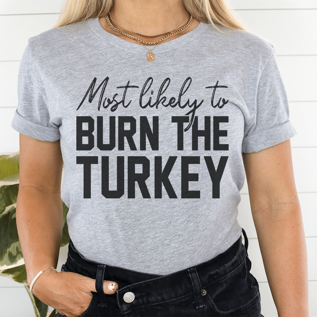 Most Likely To Burn The Turkey Thanksgiving Tee shopmerchmallow Most Likely To Burn The Turkey Thanksgiving Tee