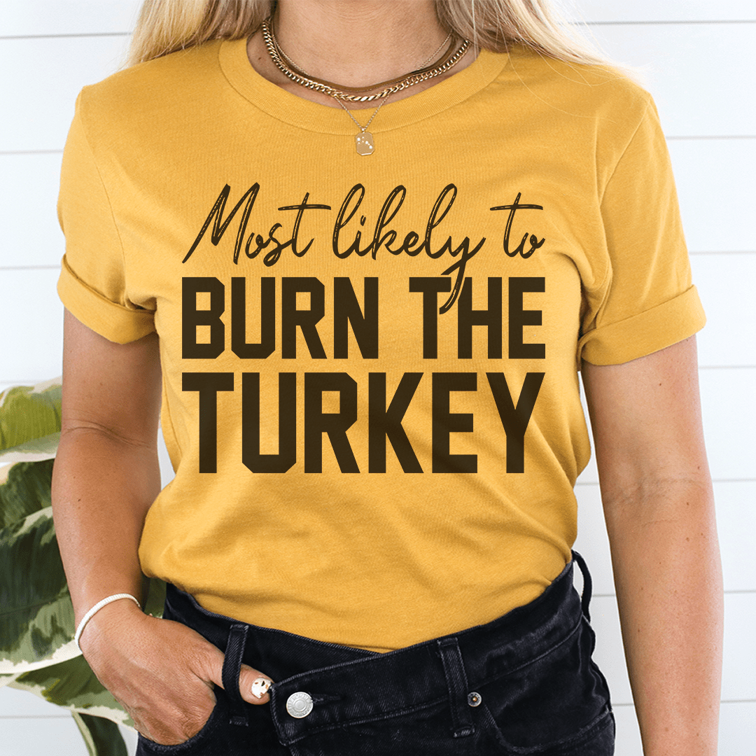 Most Likely To Burn The Turkey Thanksgiving Tee shopmerchmallow Most Likely To Burn The Turkey Thanksgiving Tee