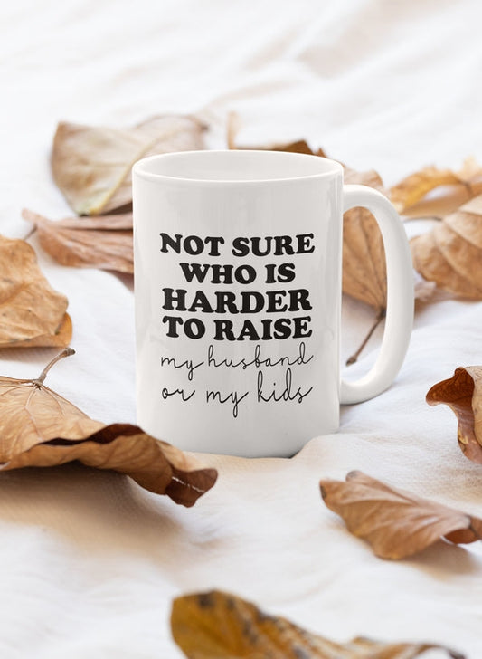 Not Sure Who Is Harder To Raise My Husband Or My Kids Mug